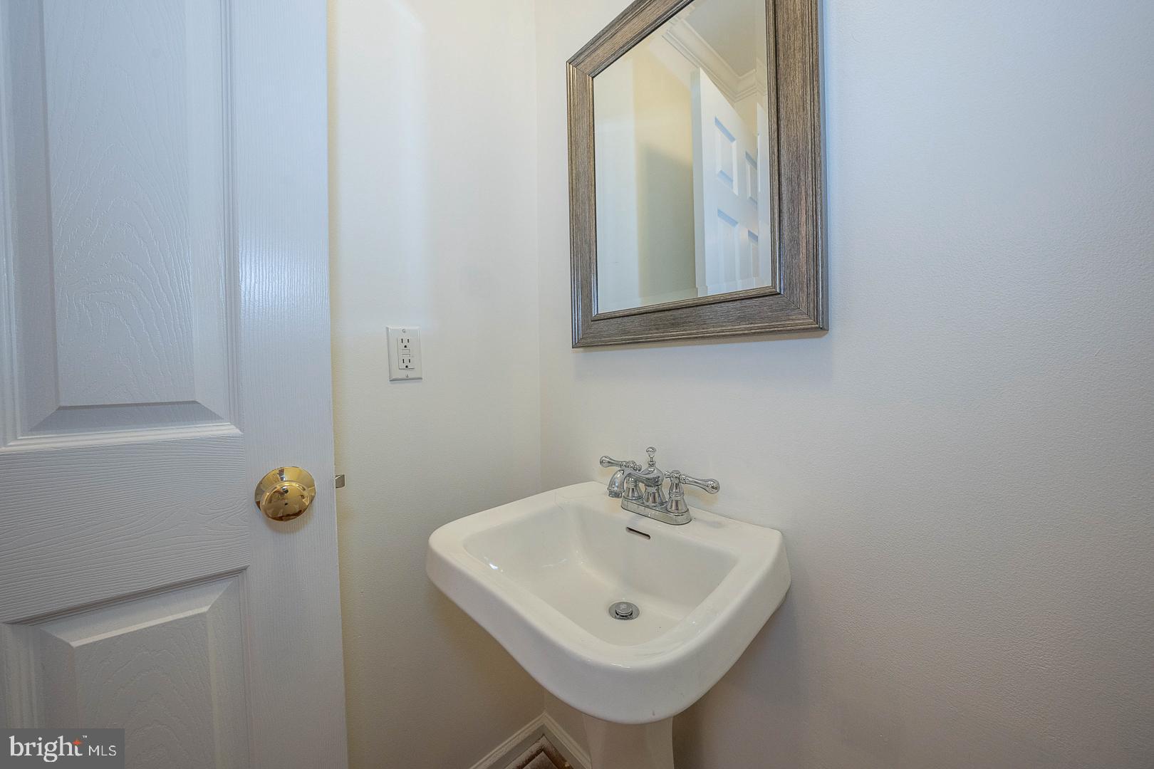 231 Plant Avenue Wayne, PA 19087 - Photo 8 of 35 a bathroom with a sink a mirror and vanity