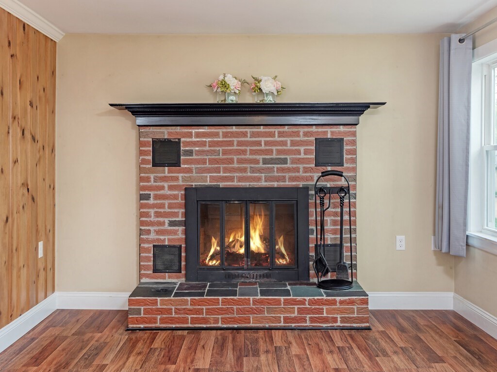 10 Hamilton Drive Holland, MA 01521 - Photo 18 of 40 a living room with fireplace and wooden floor