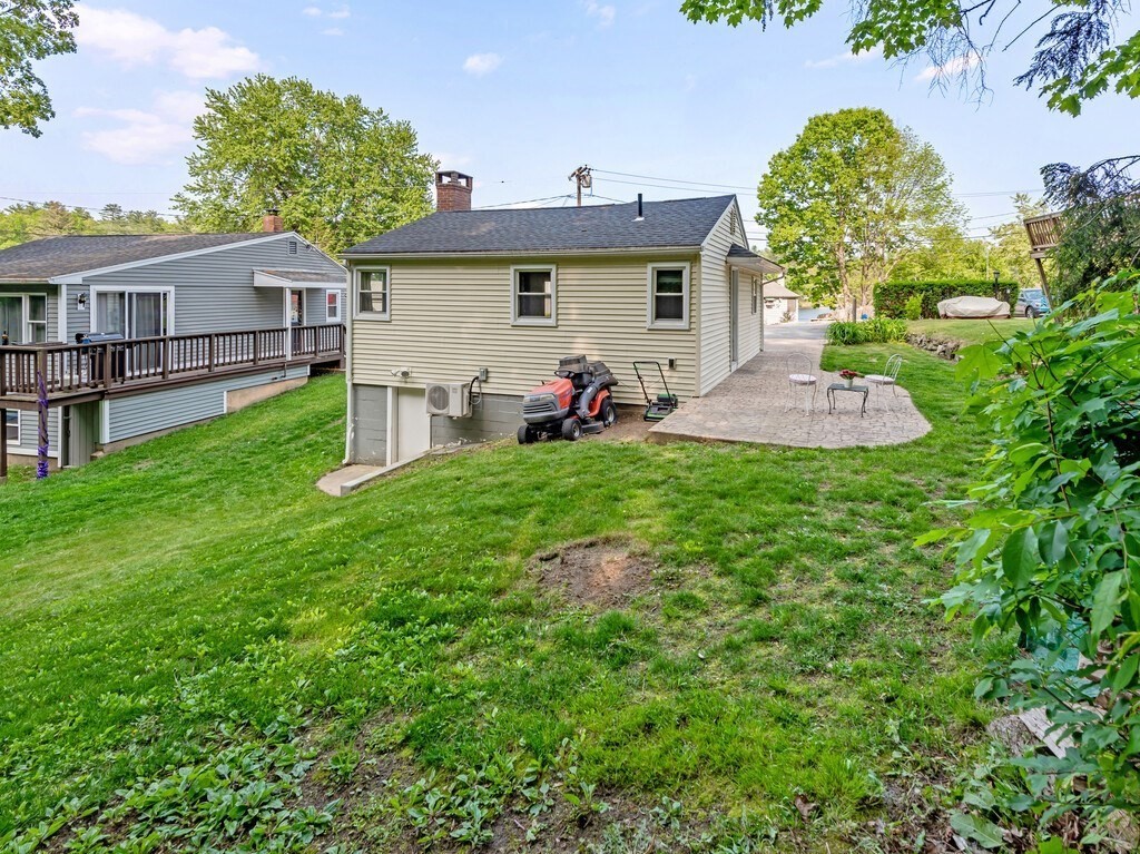 10 Hamilton Drive Holland, MA 01521 - Photo 23 of 40 a view of a house with a backyard and a patio