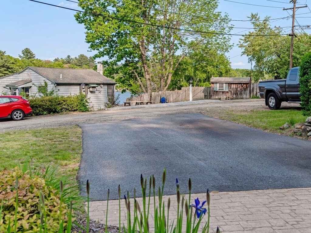10 Hamilton Drive Holland, MA 01521 - Photo 26 of 40 a view of a house with a yard and potted plants