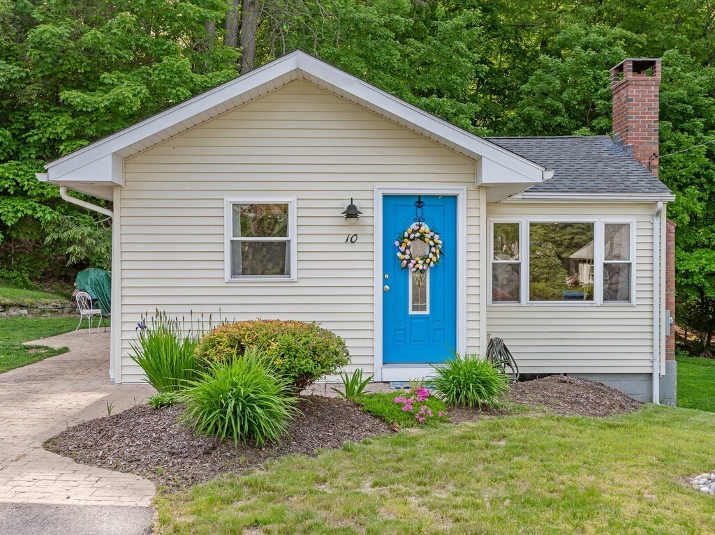 10 Hamilton Drive Holland, MA 01521 - Photo 3 of 40 a view of a house with potted plants and a table and chair