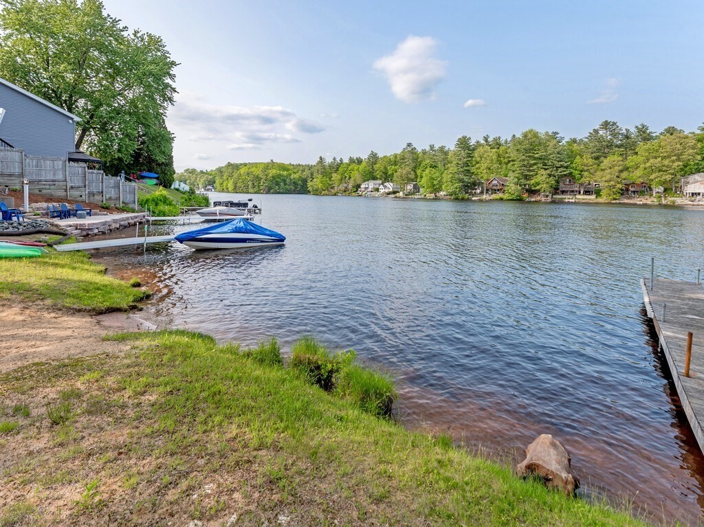 10 Hamilton Drive Holland, MA 01521 - Photo 31 of 40 a view of a lake with lawn chairs and a large tree