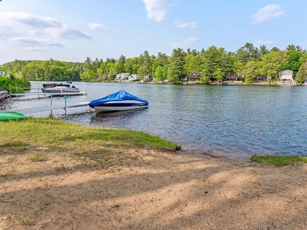 10 Hamilton Drive Holland, MA 01521 - Photo 32 of 40 a backyard of a house with chairs and lake view