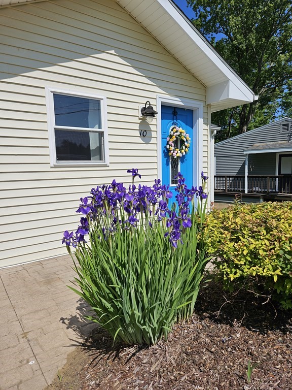 10 Hamilton Drive Holland, MA 01521 - Photo 40 of 40 a front view of a house with a flower garden