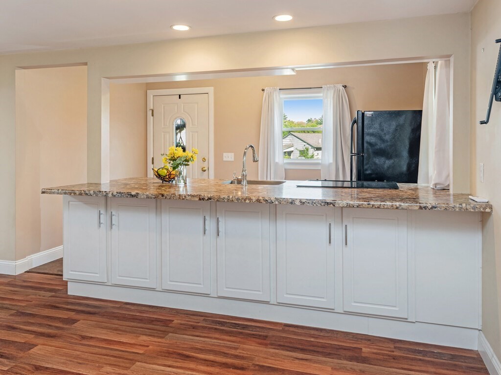 10 Hamilton Drive Holland, MA 01521 - Photo 9 of 40 a view of a hallway with wooden floor and cabinet