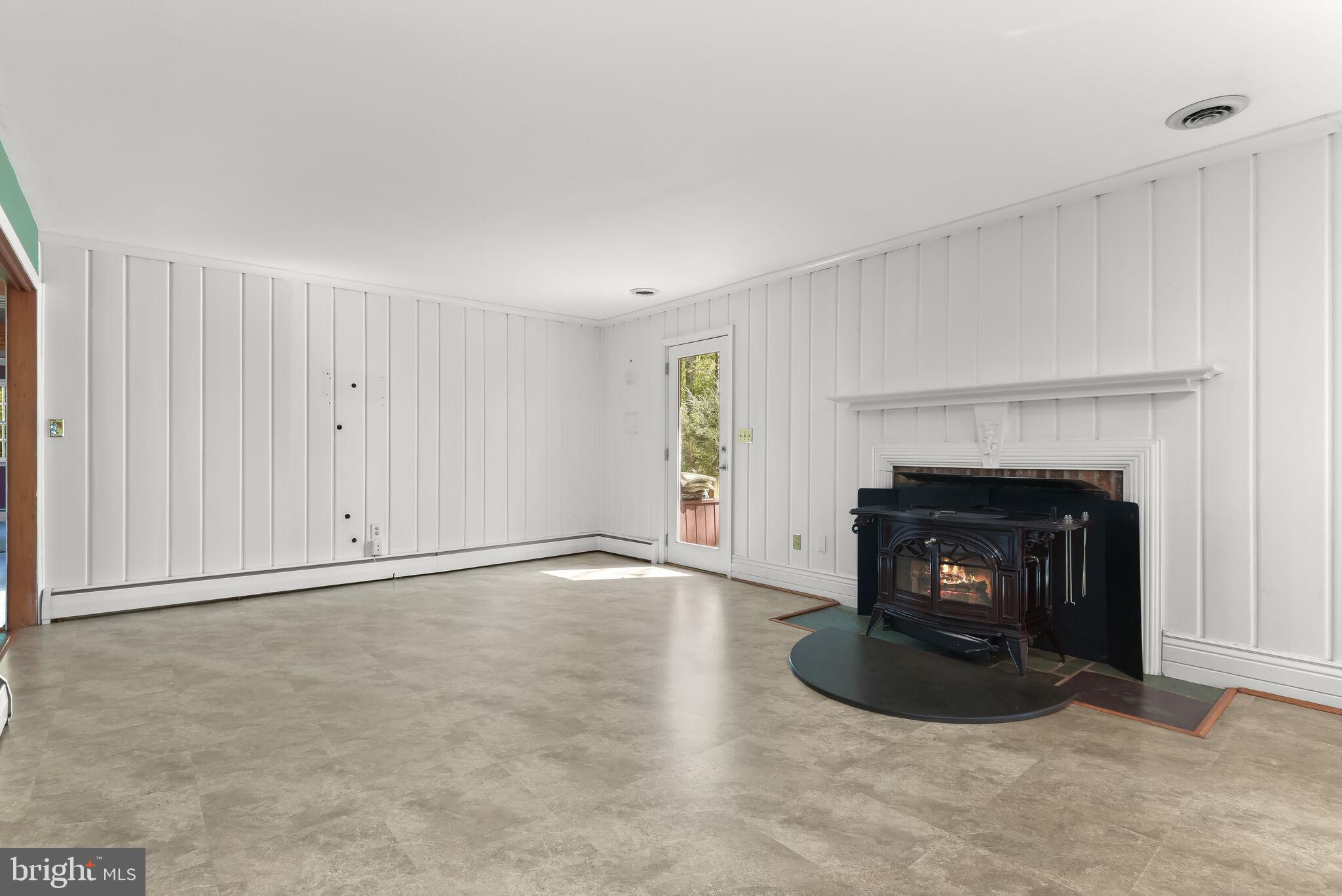 4049 Linthicum Road Dayton, MD 21036 - Photo 32 of 95 Family room with WB stove & deck access