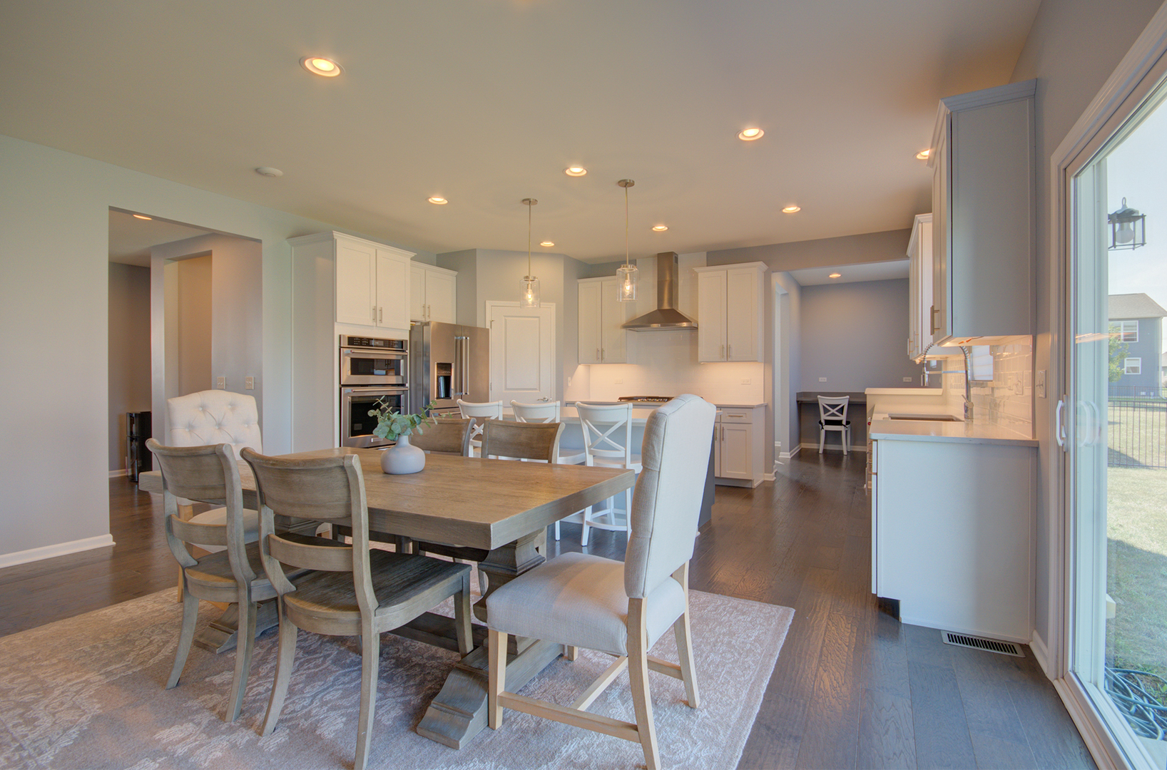 15728 Brook Shore Drive Plainfield, IL 60544 - Photo 11 of 36 a view of a dining room with furniture and wooden floor
