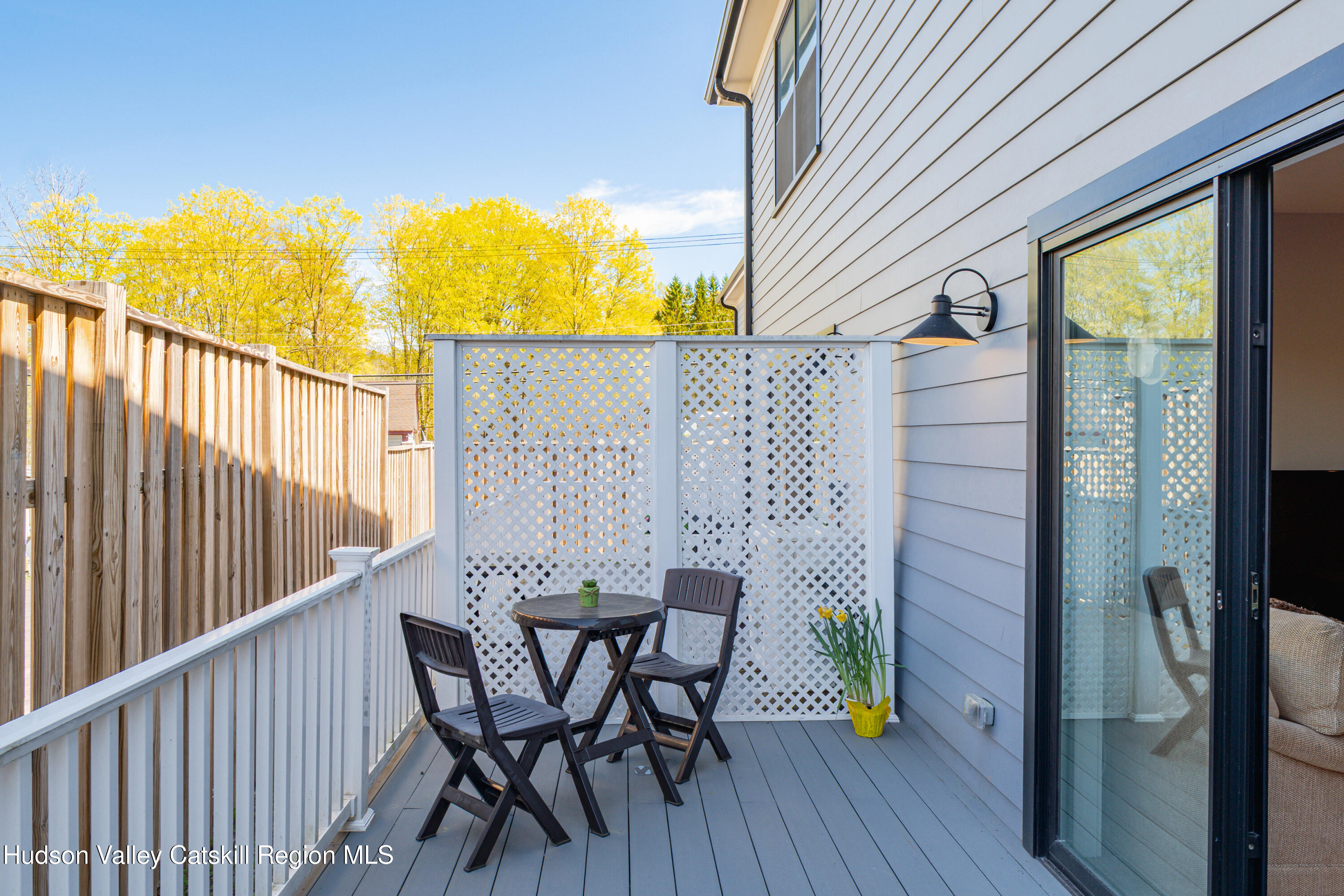 71 County Road 65, Unit 4 Windham, NY 12439 - Photo 12 of 33 a view of a balcony with table and chairs and wooden floor