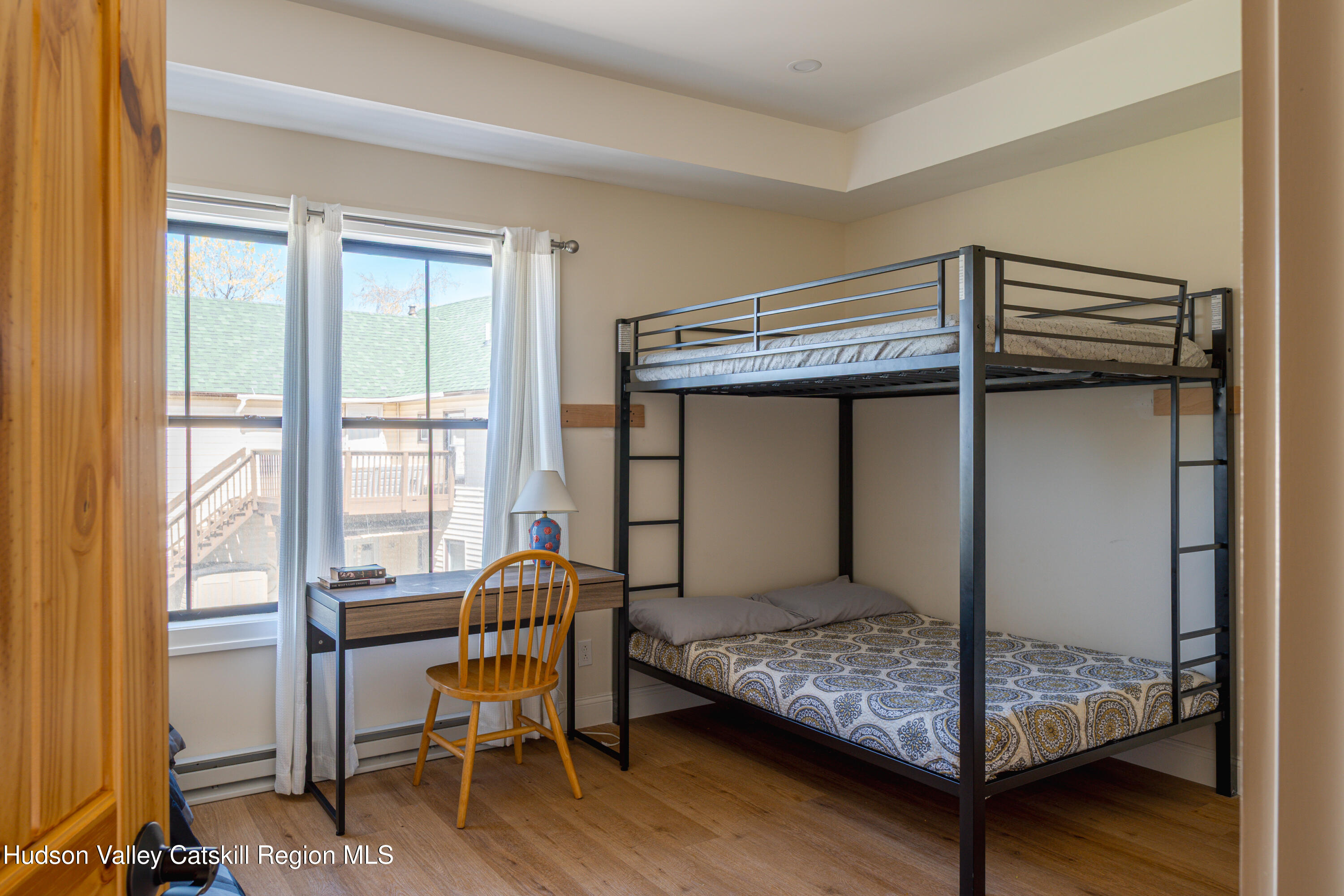 71 County Road 65, Unit 4 Windham, NY 12439 - Photo 17 of 33 a bedroom with a bed and a window