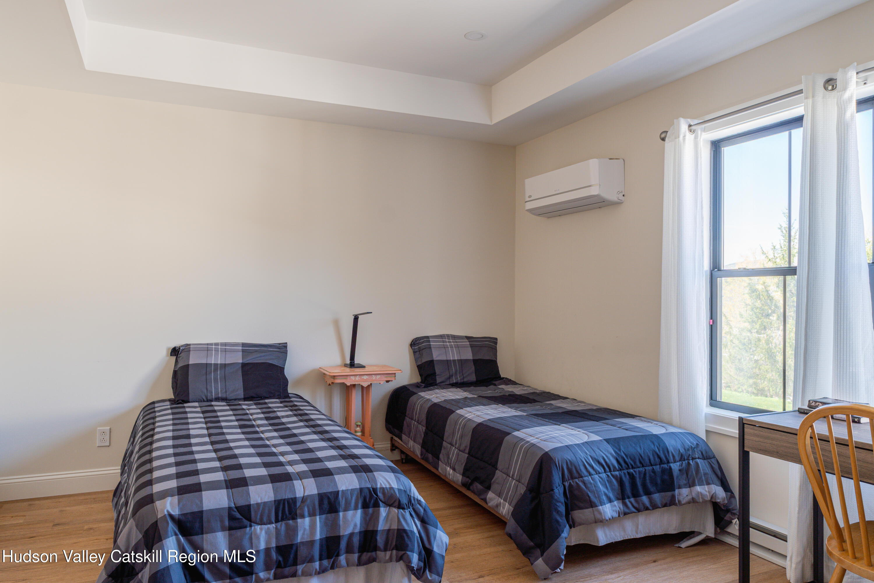 71 County Road 65, Unit 4 Windham, NY 12439 - Photo 19 of 33 a bedroom with two beds and a window