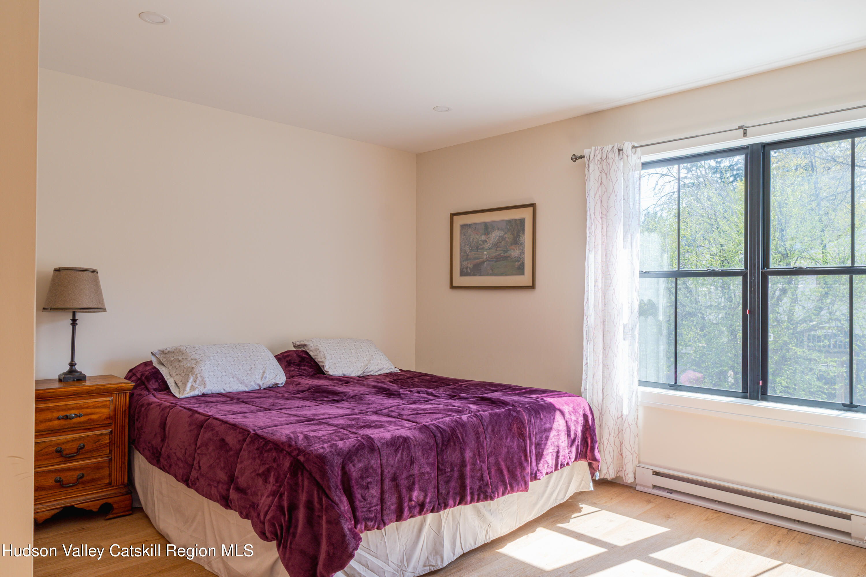 71 County Road 65, Unit 4 Windham, NY 12439 - Photo 21 of 33 a bedroom with a bed and a window
