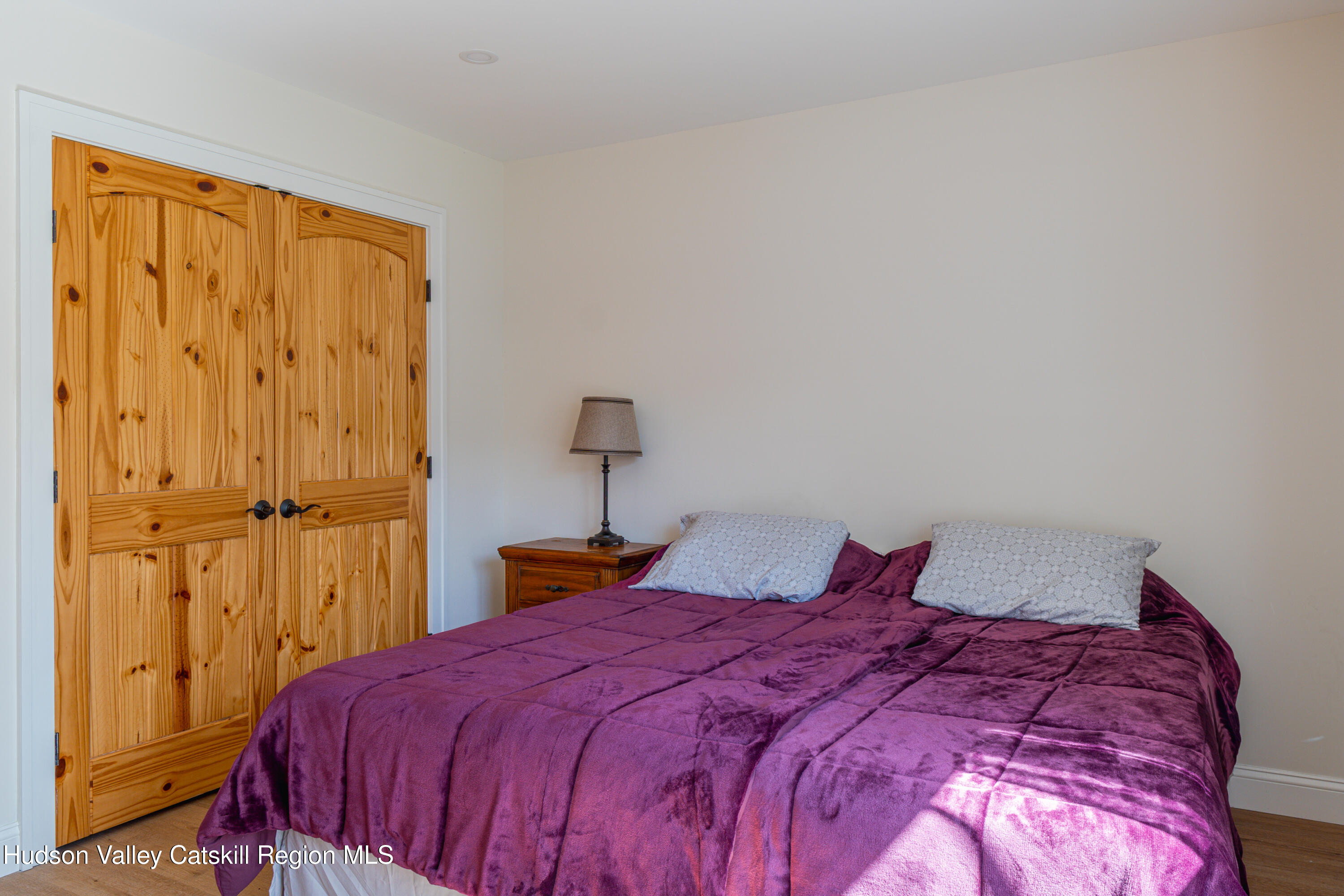 71 County Road 65, Unit 4 Windham, NY 12439 - Photo 22 of 33 a bedroom with a bed and a closet