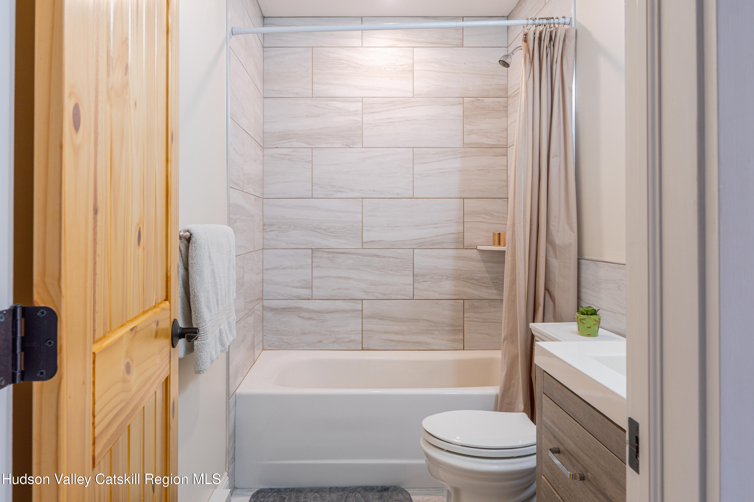 71 County Road 65, Unit 4 Windham, NY 12439 - Photo 23 of 33 a bathroom with a shower a toilet and a bathtub