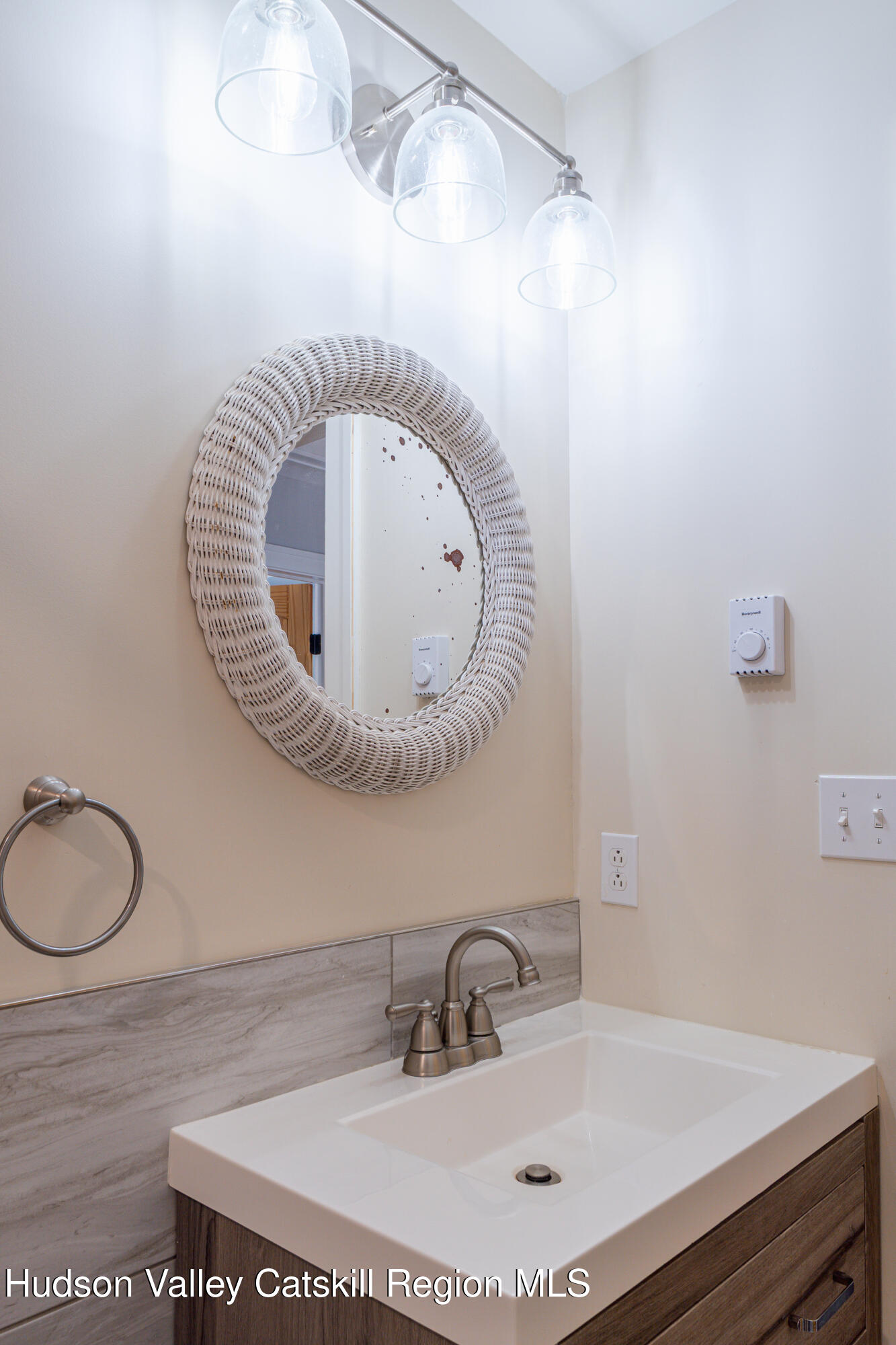 71 County Road 65, Unit 4 Windham, NY 12439 - Photo 27 of 33 a bathroom with a sink and a mirror