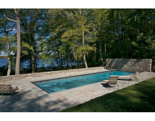 55 Sandy Pond Road Lincoln, MA 01773 - Photo 12 of 14 a backyard of a house with table and chairs