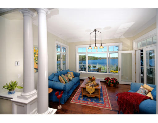 55 Sandy Pond Road Lincoln, MA 01773 - Photo 4 of 14 a living room with furniture a chandelier and a large window