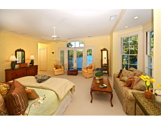 55 Sandy Pond Road Lincoln, MA 01773 - Photo 6 of 14 a bedroom with a bed and large windows