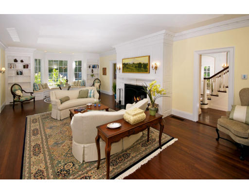 55 Sandy Pond Road Lincoln, MA 01773 - Photo 9 of 14 a living room with furniture and a fireplace