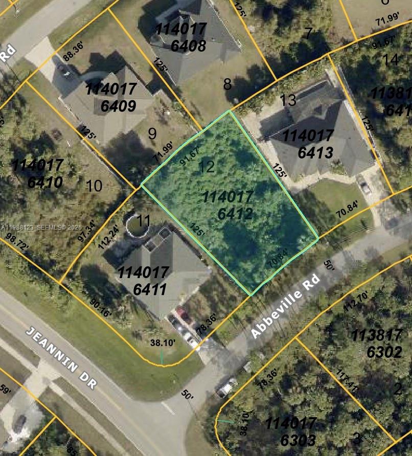Lot 12 Abbeville Road North Port, FL 34288 - Photo 3 of 3 an aerial view of a house with a garden and plants
