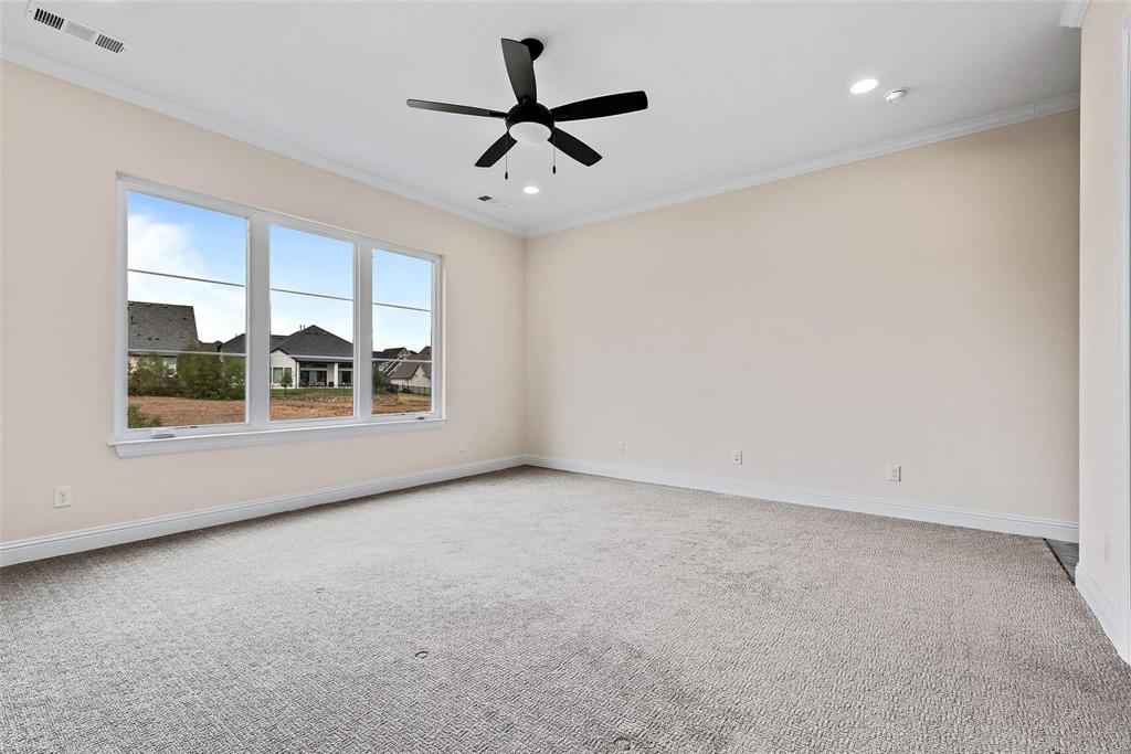 1920 Shumard Way Fort Worth, TX 76008 - Photo 17 of 40 an empty room with windows and ceiling fan