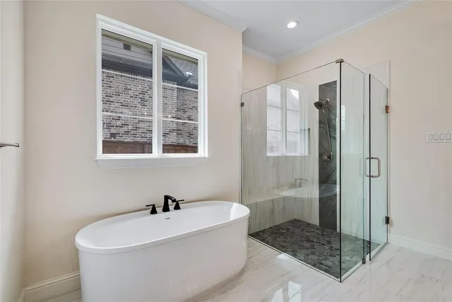 a white bath tub sitting next to a shower