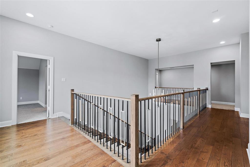 1920 Shumard Way Fort Worth, TX 76008 - Photo 22 of 40 a view of a hallway with wooden floor and a bathroom
