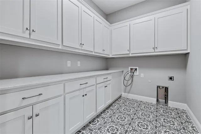a kitchen with white cabinets and a sink