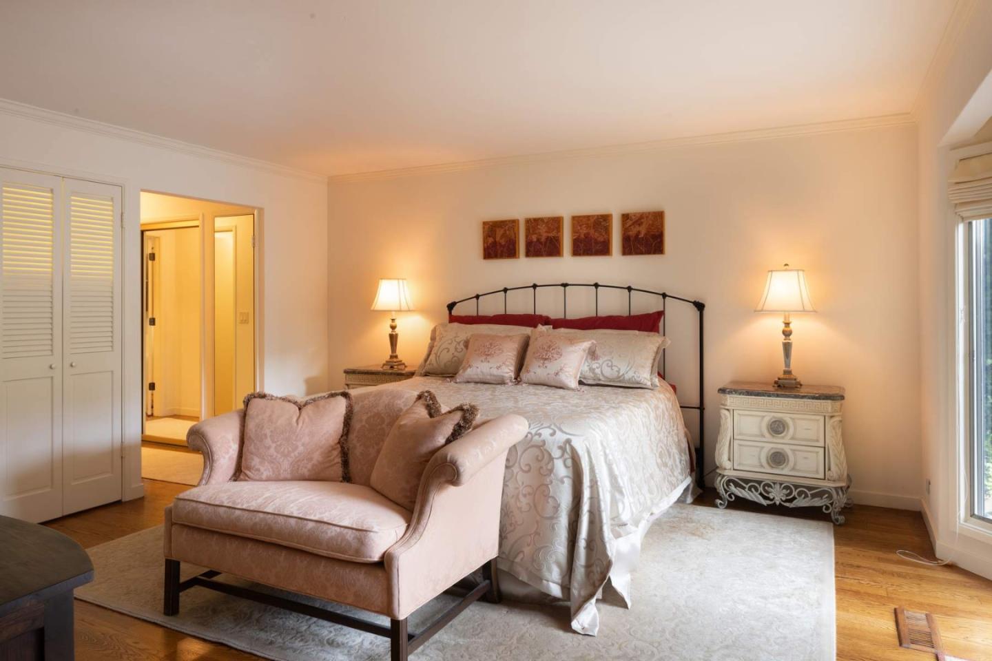 3041 Strawberry Hill Road Pebble Beach, CA 93953 - Photo 16 of 31 a bedroom with a bed and a couch