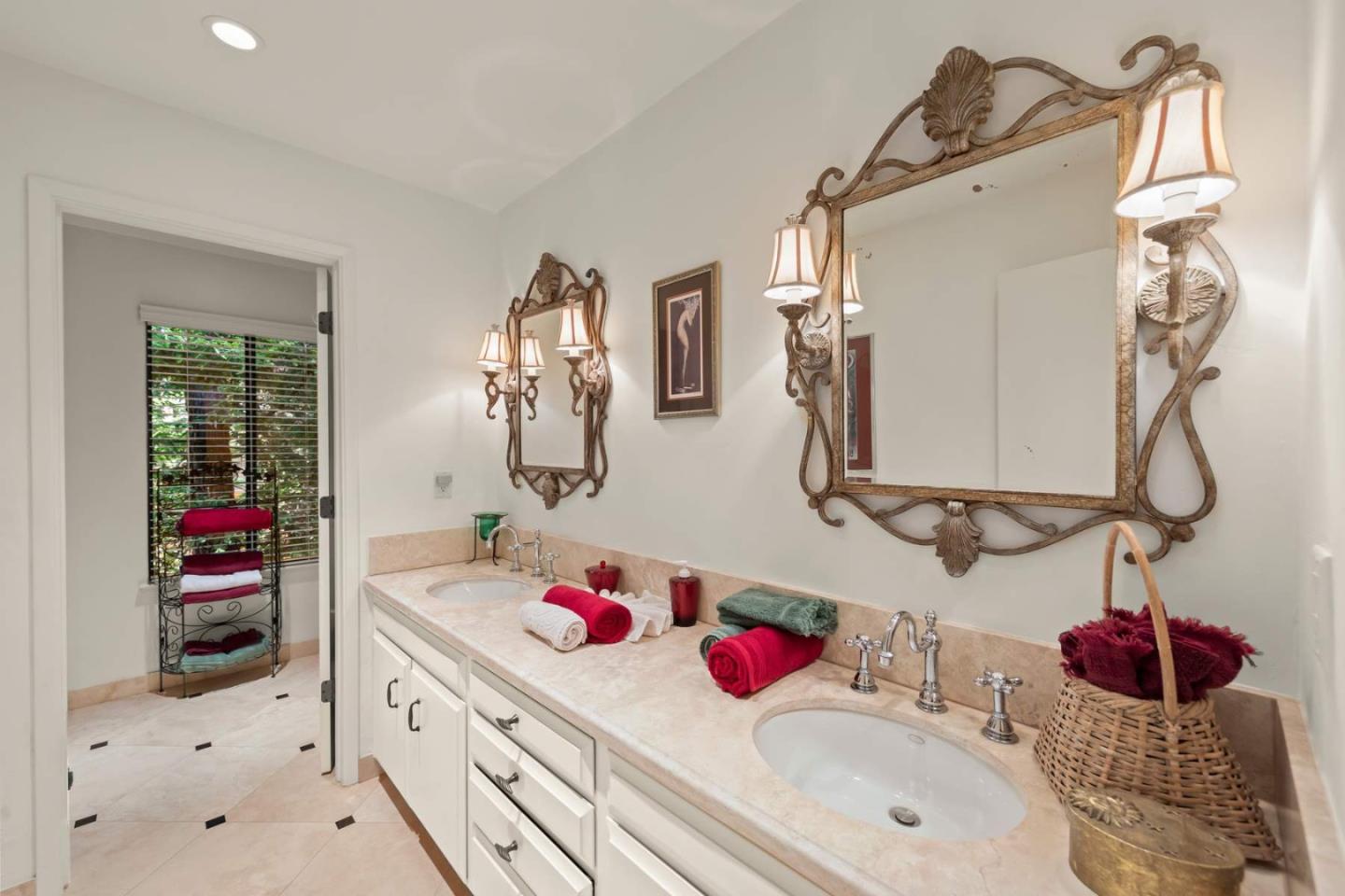 3041 Strawberry Hill Road Pebble Beach, CA 93953 - Photo 21 of 31 a bathroom with a sink mirror and vanity