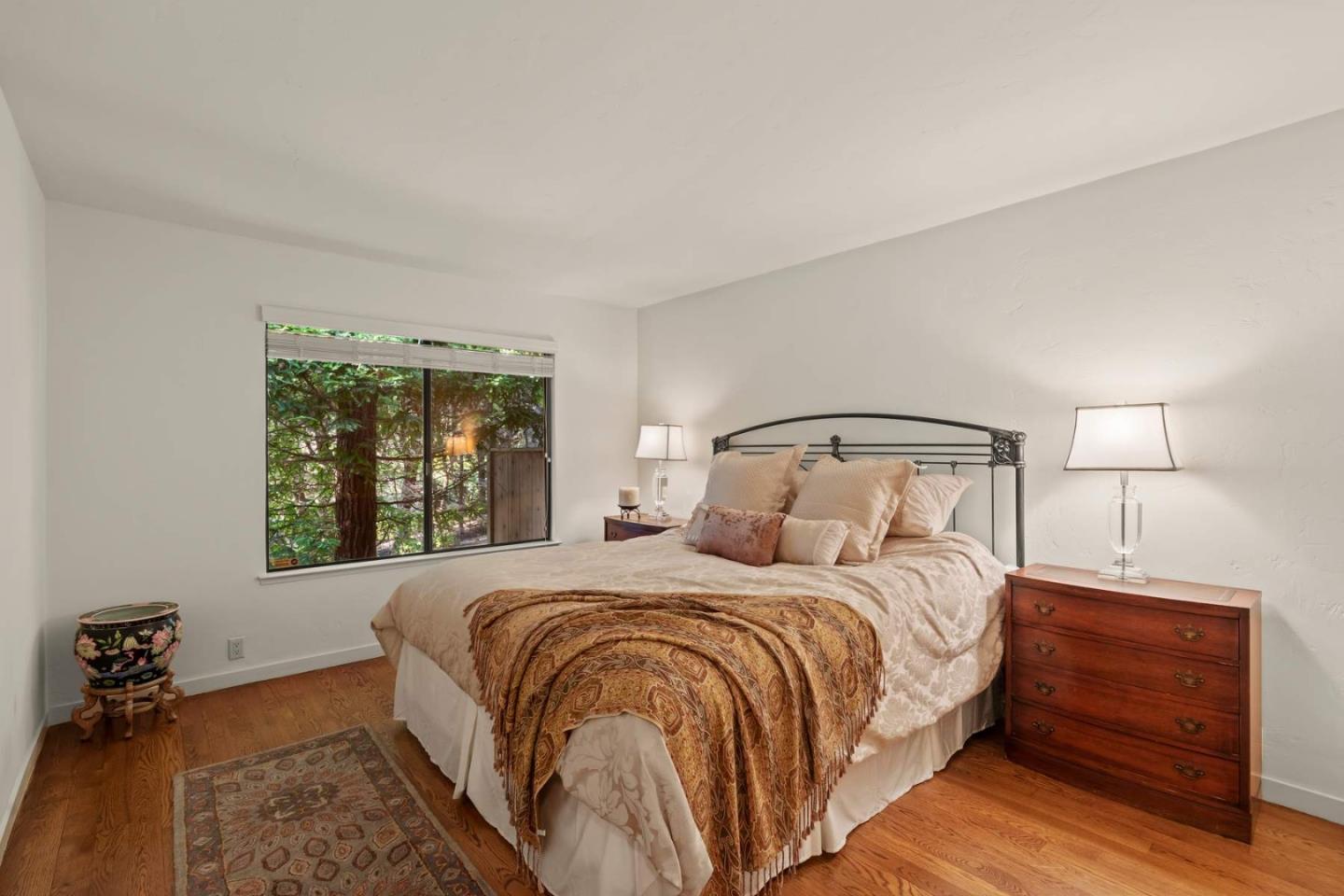 3041 Strawberry Hill Road Pebble Beach, CA 93953 - Photo 22 of 31 a bedroom with a bed and a window
