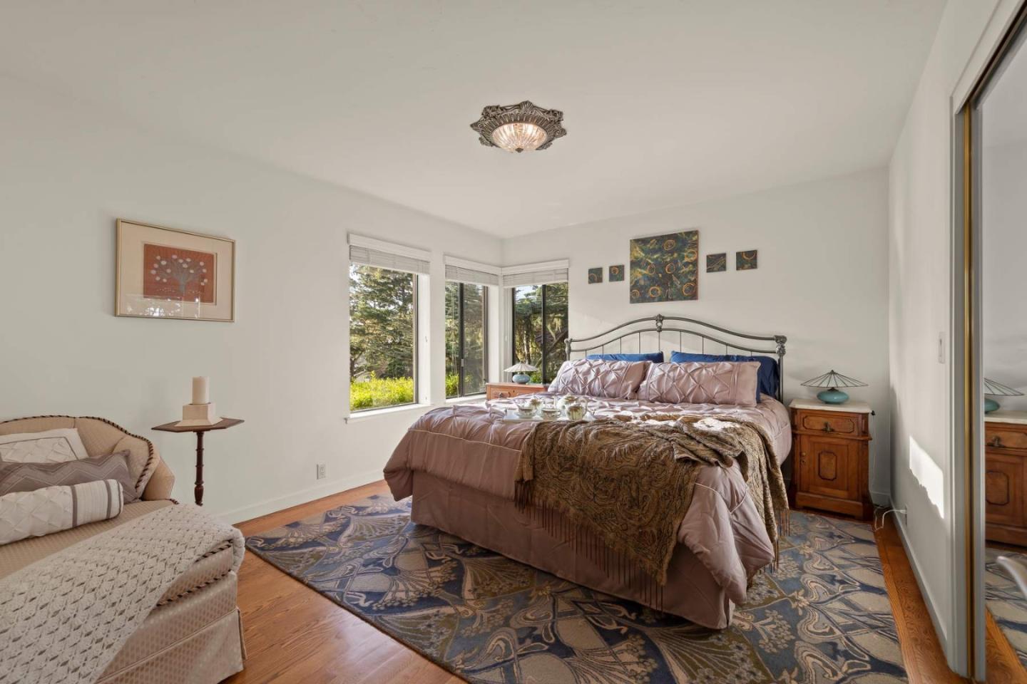 3041 Strawberry Hill Road Pebble Beach, CA 93953 - Photo 24 of 31 a bedroom with a bed and window