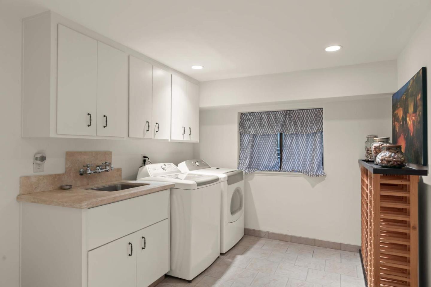 3041 Strawberry Hill Road Pebble Beach, CA 93953 - Photo 26 of 31 a room with a sink cabinets and utility