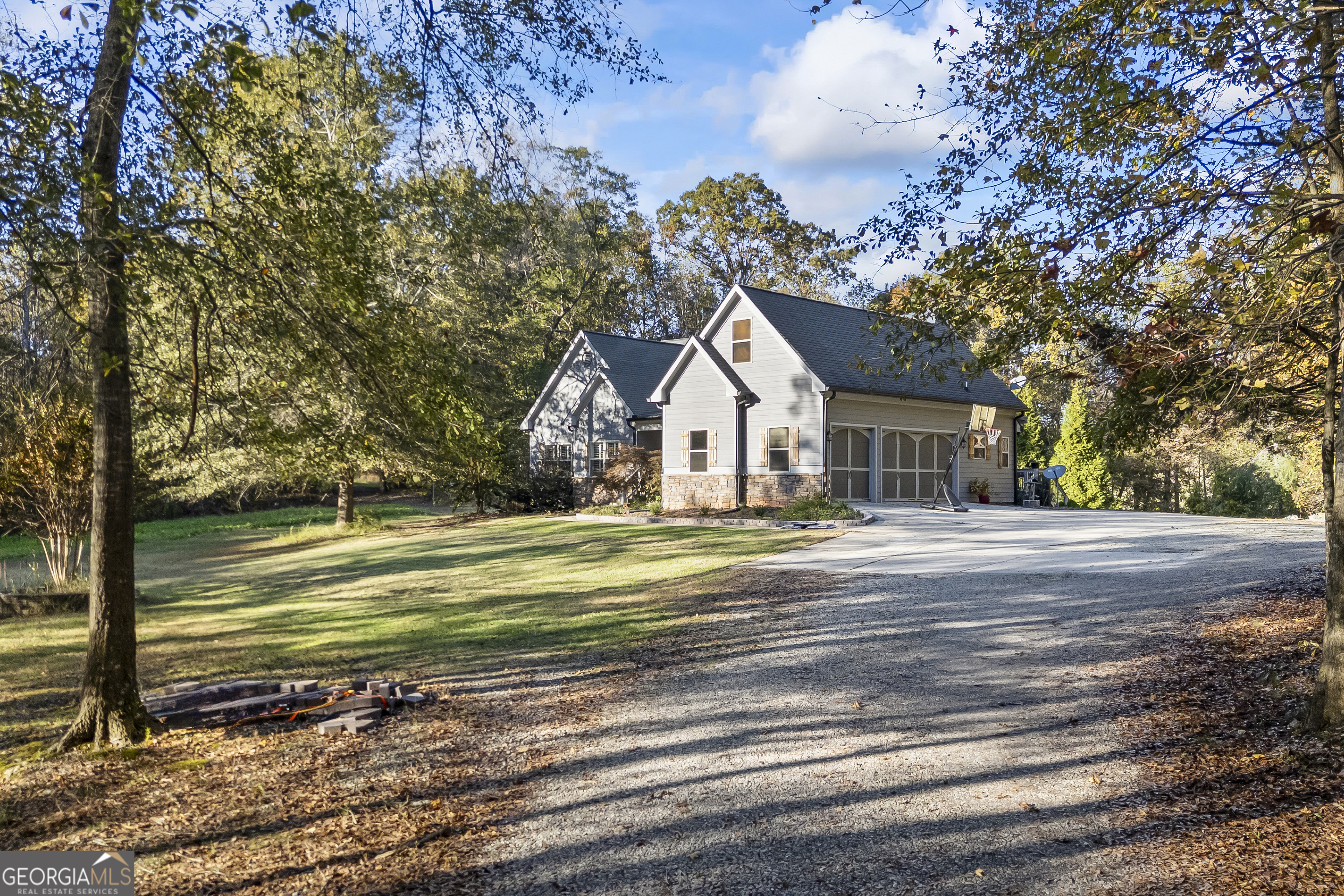 135 Canters Run Homer, GA 30547 - Photo 12 of 96 a front view of a house with a garden