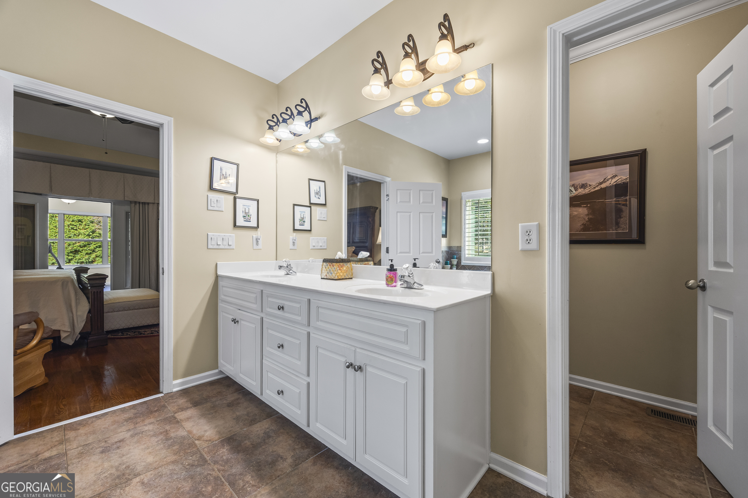 135 Canters Run Homer, GA 30547 - Photo 39 of 96 a spacious bathroom with a double vanity sink and a mirror