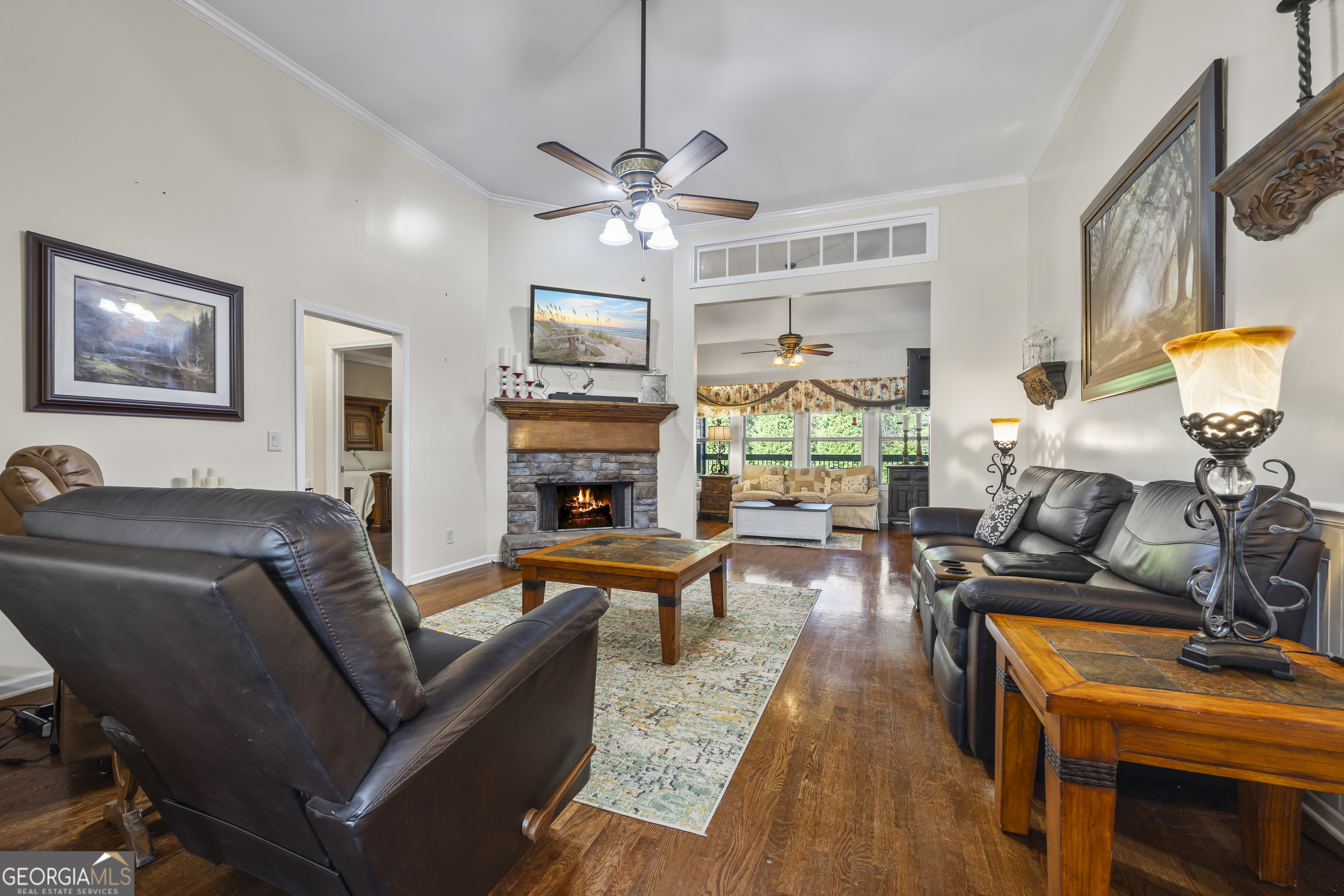 135 Canters Run Homer, GA 30547 - Photo 46 of 96 a living room with furniture a fireplace and a flat screen tv
