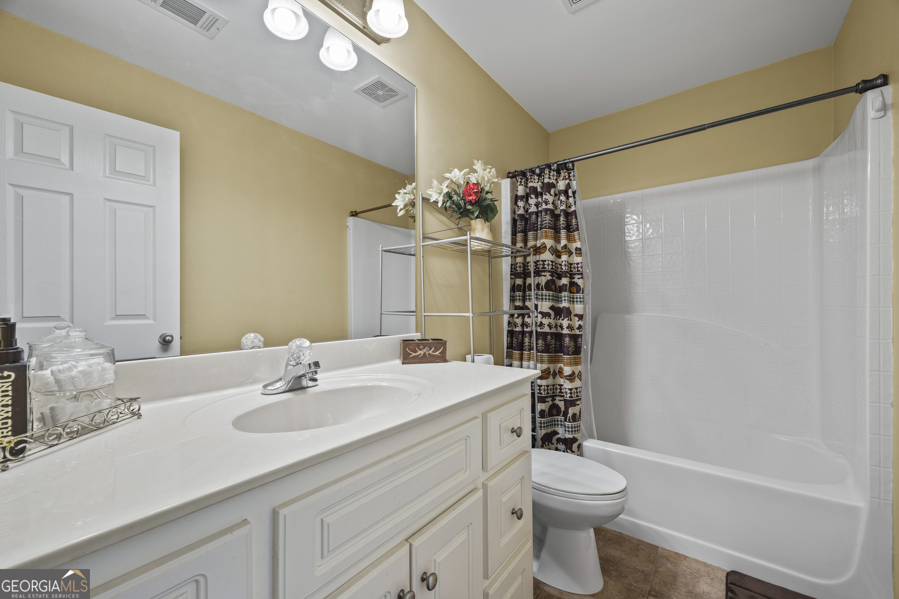 135 Canters Run Homer, GA 30547 - Photo 59 of 96 a bathroom with a sink a toilet and shower curtain