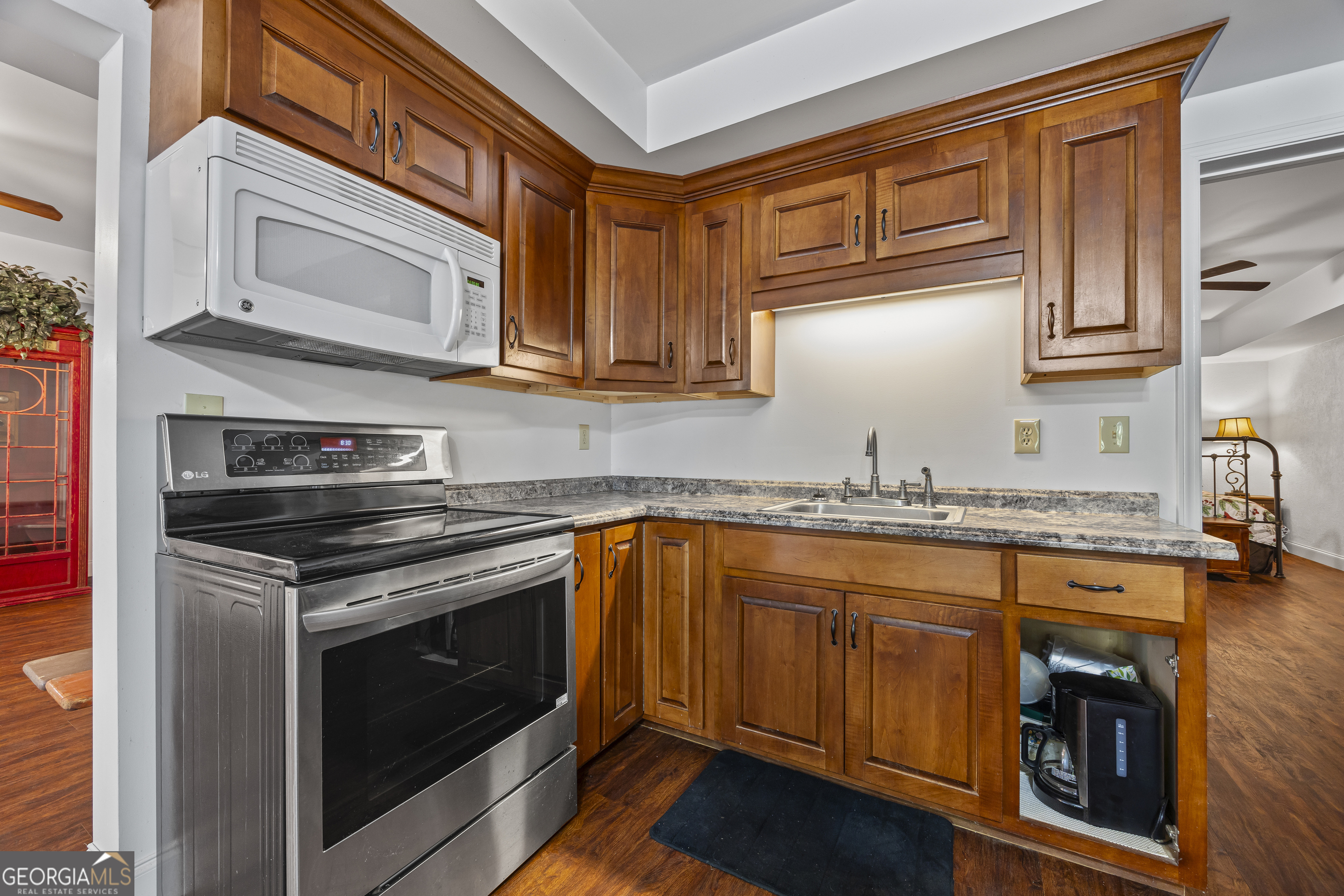 135 Canters Run Homer, GA 30547 - Photo 78 of 96 a kitchen with stainless steel appliances granite countertop a stove and a microwave