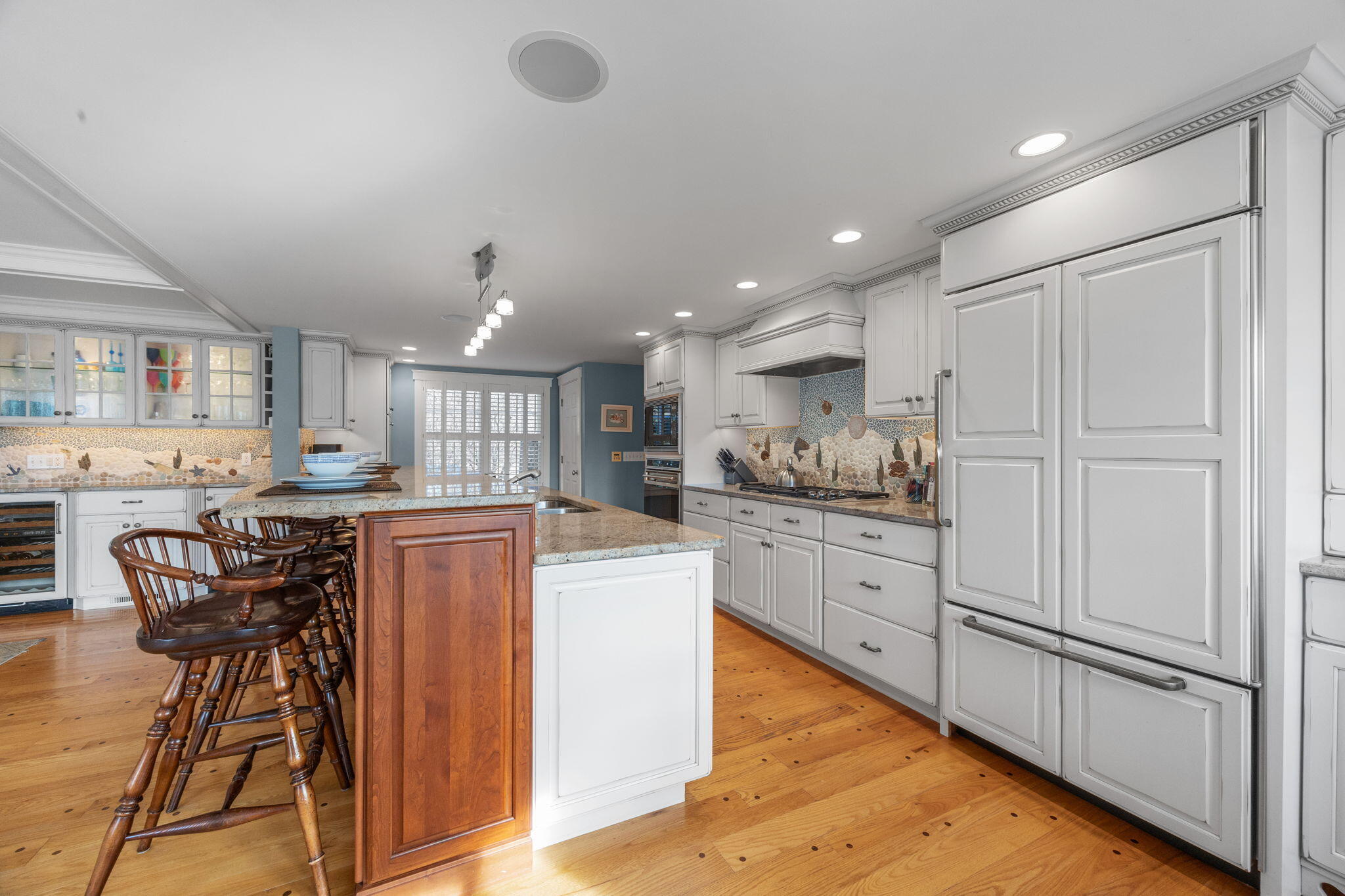 404 Stage Harbor Road Chatham, MA 02633 - Photo 13 of 94 a kitchen with granite countertop white cabinets and stainless steel appliances