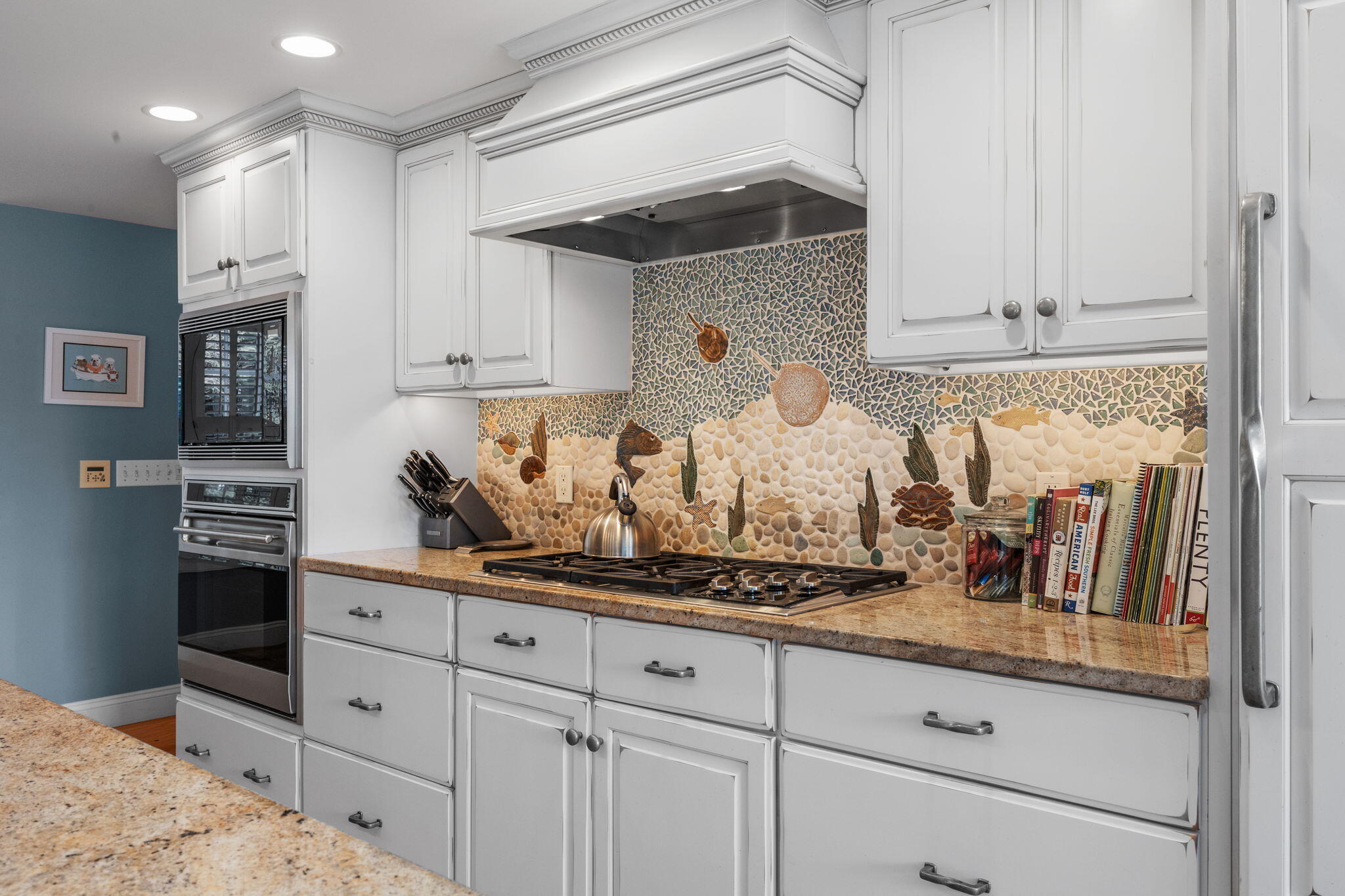 404 Stage Harbor Road Chatham, MA 02633 - Photo 17 of 94 a kitchen with white cabinets and appliances