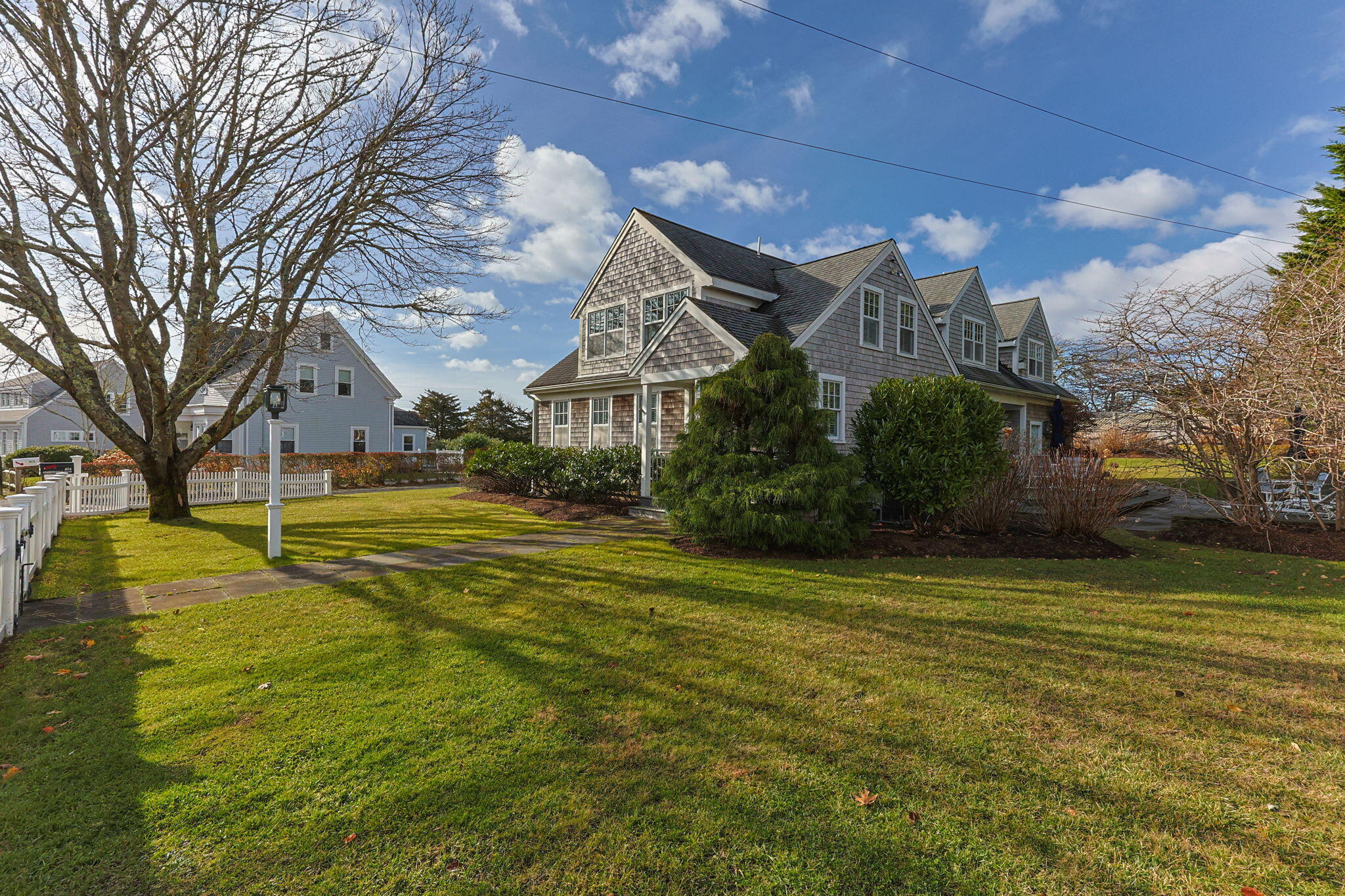 404 Stage Harbor Road Chatham, MA 02633 - Photo 4 of 94 a view of a house with a big yard