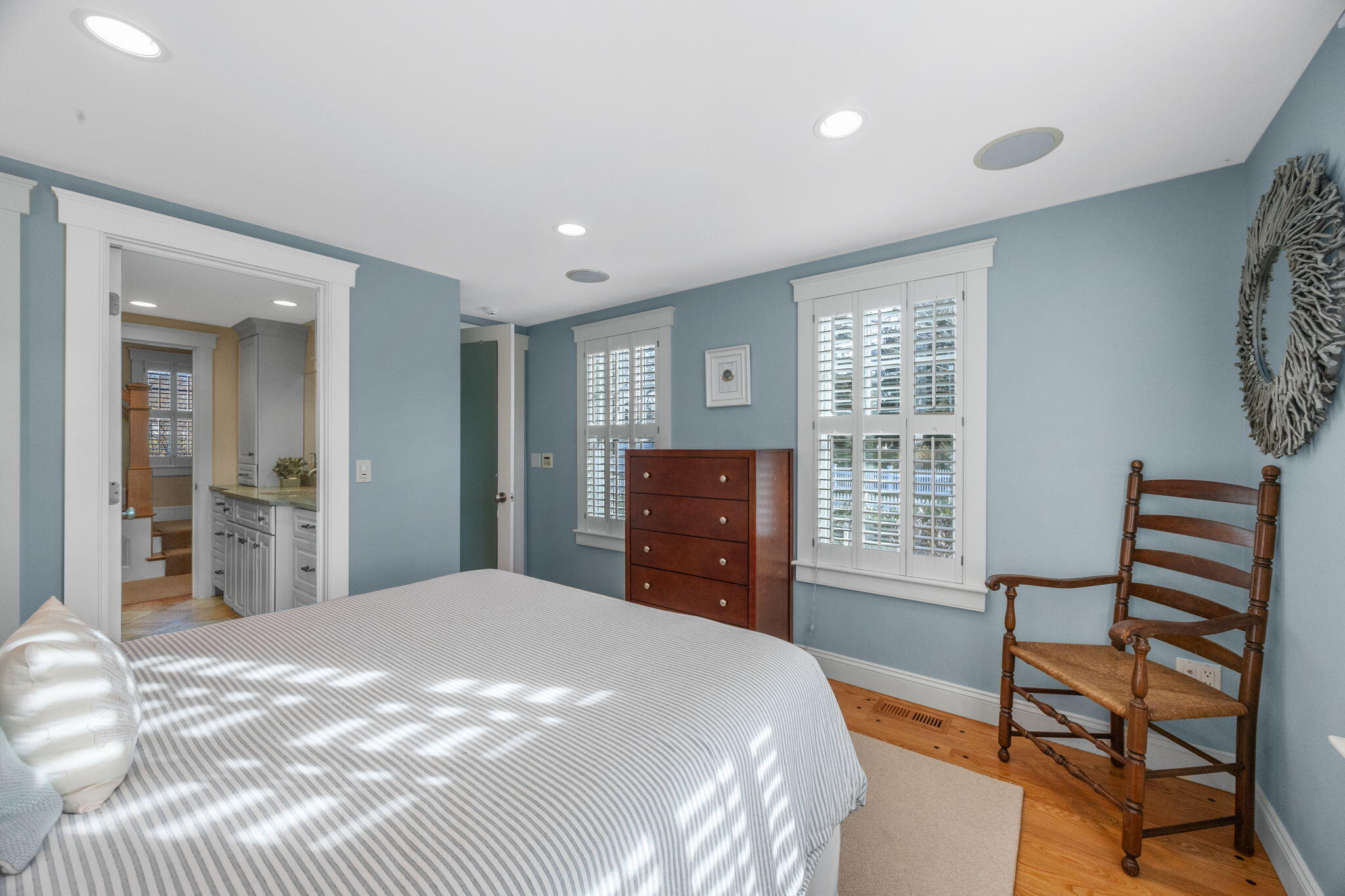 404 Stage Harbor Road Chatham, MA 02633 - Photo 41 of 94 a bedroom with a bed and a dresser with rug