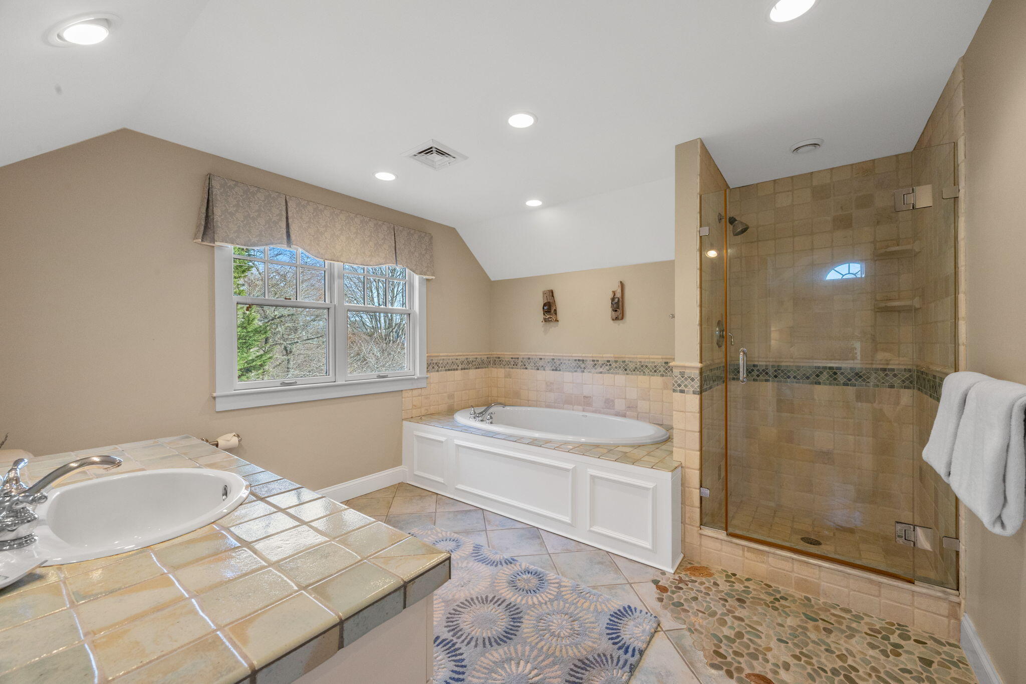 404 Stage Harbor Road Chatham, MA 02633 - Photo 53 of 94 a bathroom with a tub sink and mirror