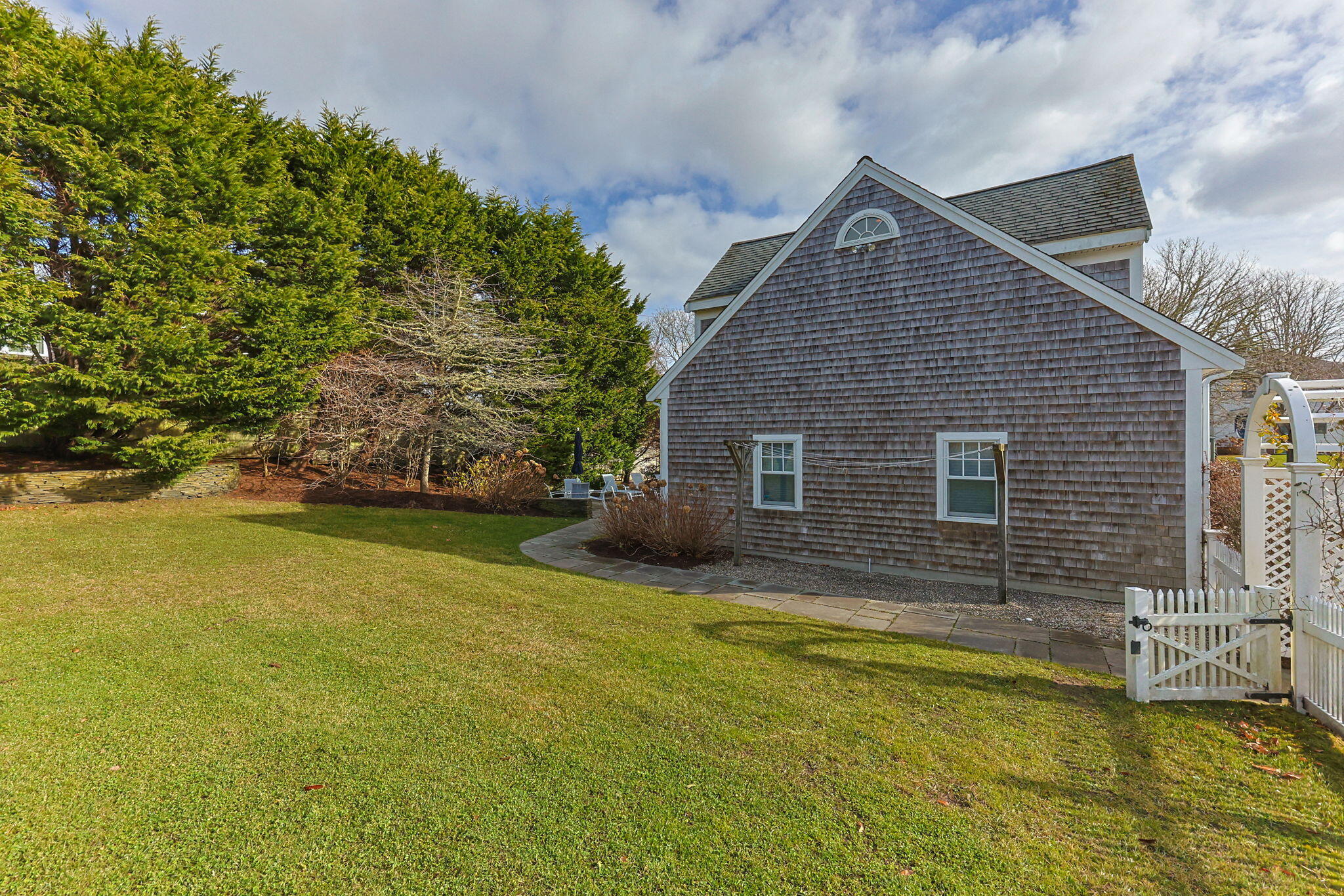 404 Stage Harbor Road Chatham, MA 02633 - Photo 78 of 94 a front view of a house with swimming pool