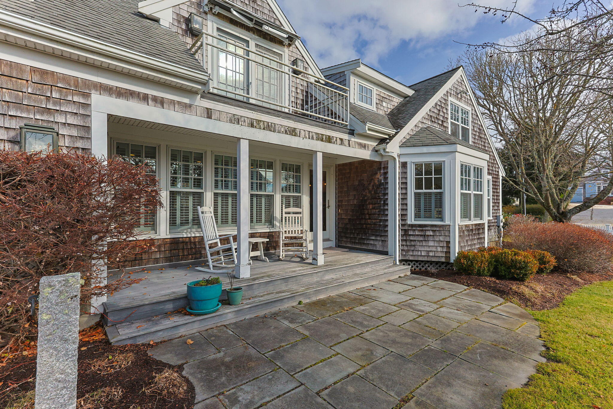 404 Stage Harbor Road Chatham, MA 02633 - Photo 8 of 94 a front view of a building with sitting area