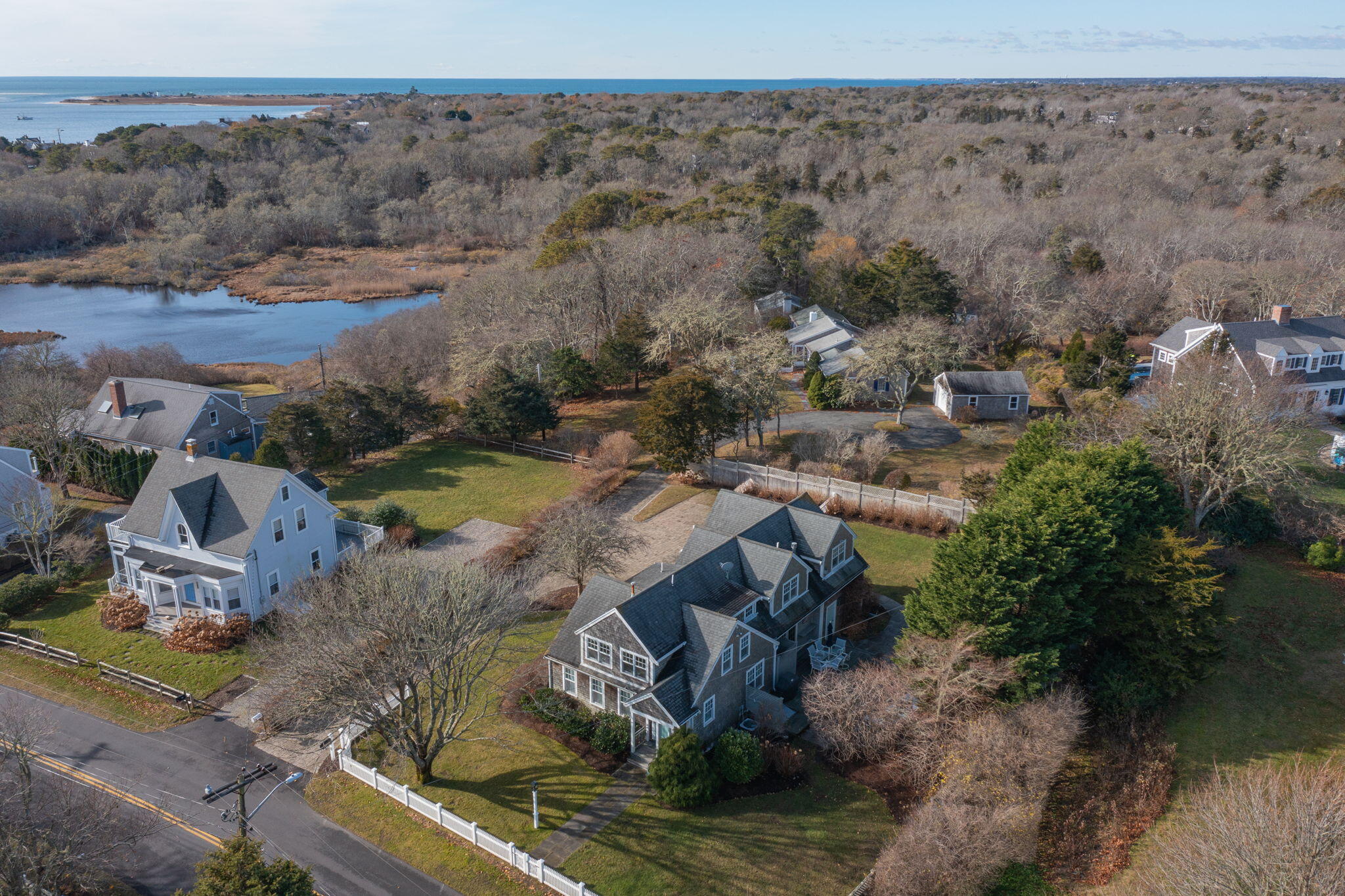 404 Stage Harbor Road Chatham, MA 02633 - Photo 83 of 94 an aerial view of a house with a yard