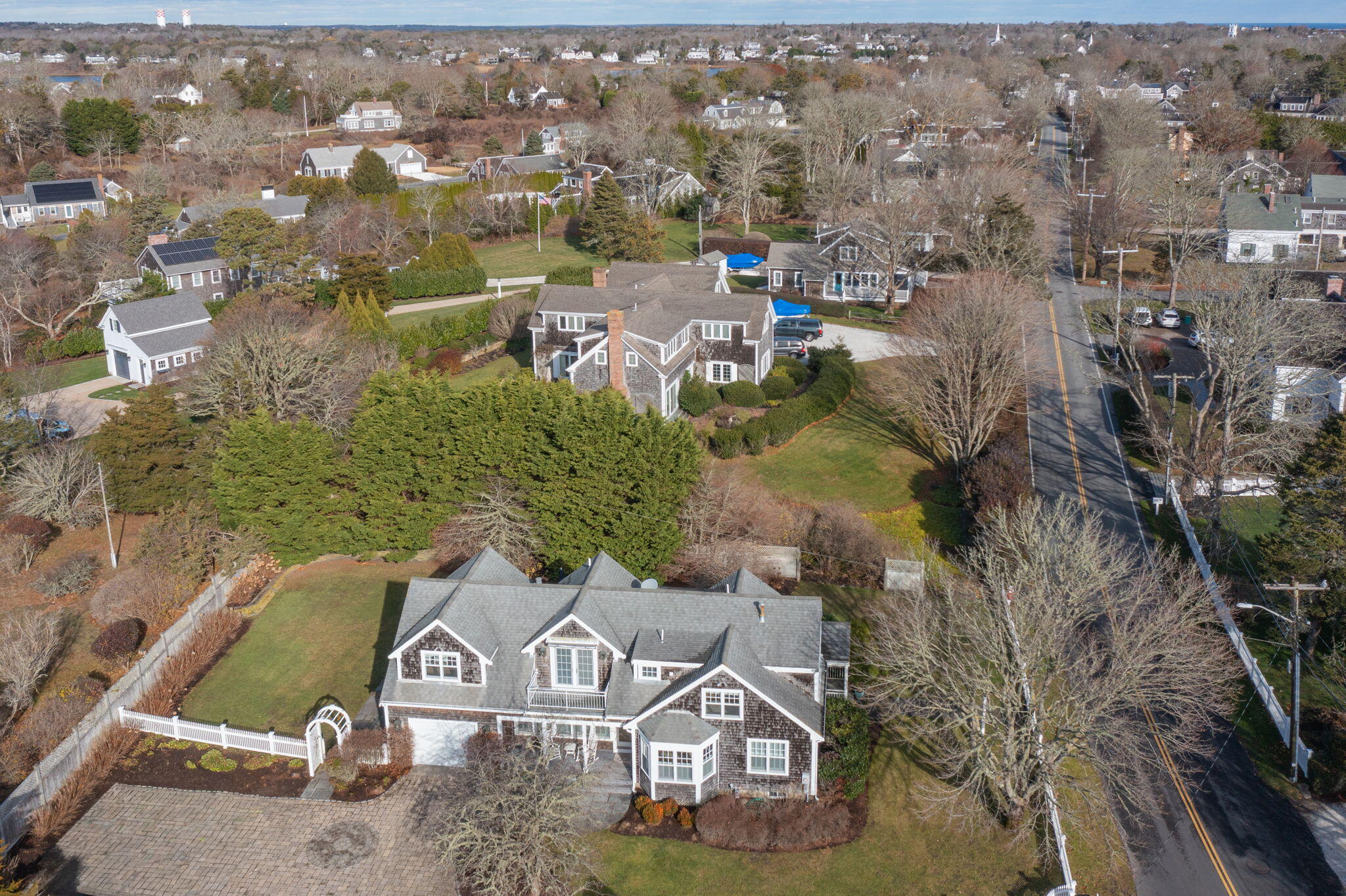 404 Stage Harbor Road Chatham, MA 02633 - Photo 85 of 94 an aerial view of a house with a yard
