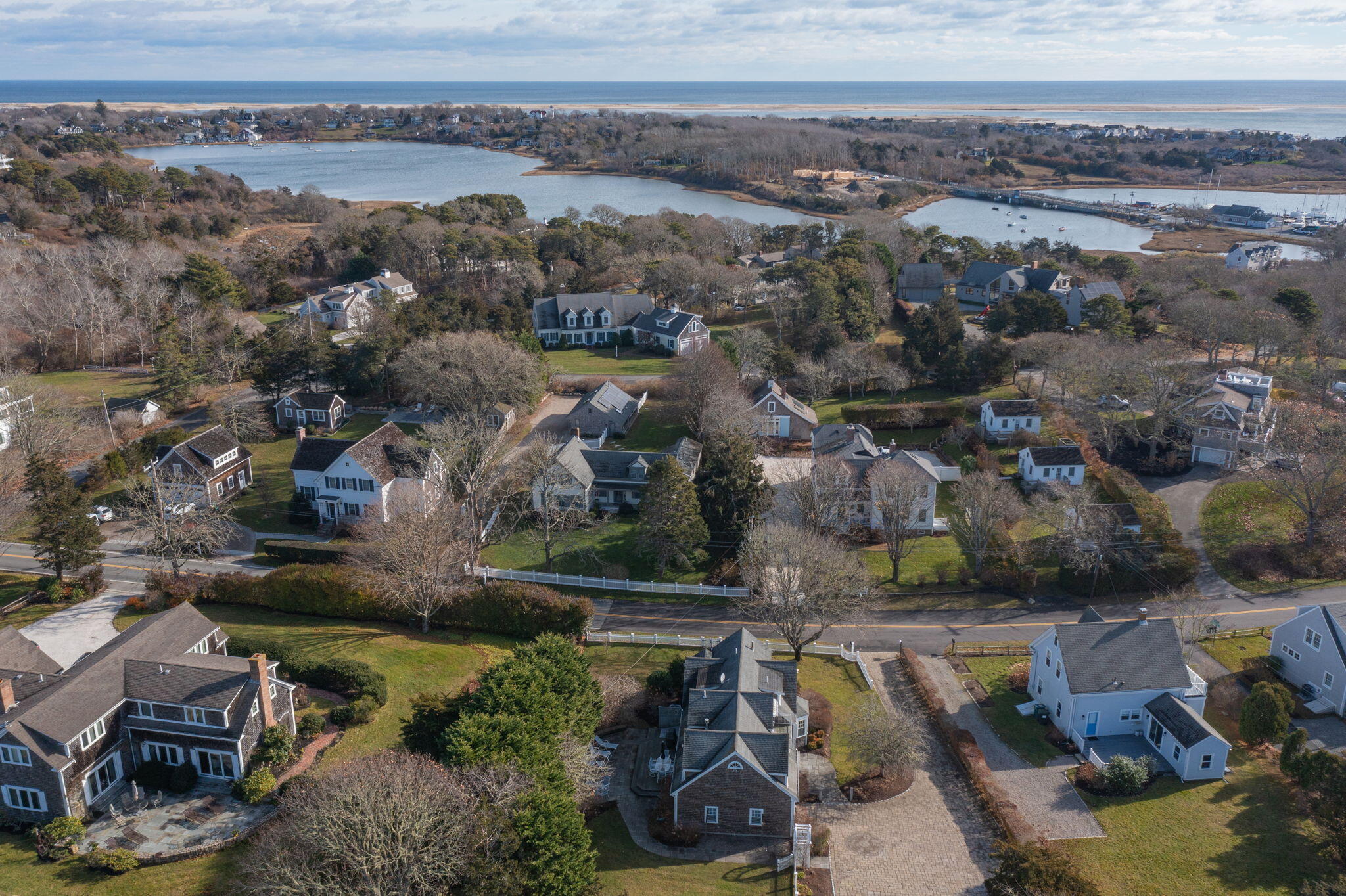 404 Stage Harbor Road Chatham, MA 02633 - Photo 86 of 94 an aerial view of residential houses with outdoor space