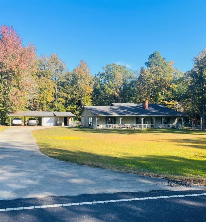 a view of a swimming pool with an outdoor space and seating area