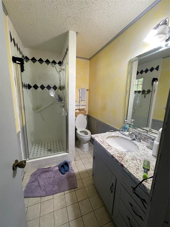 658 Cook Baker Road Sarepta, LA 71071 - Photo 5 of 8 a bathroom with a granite countertop sink a mirror and shower