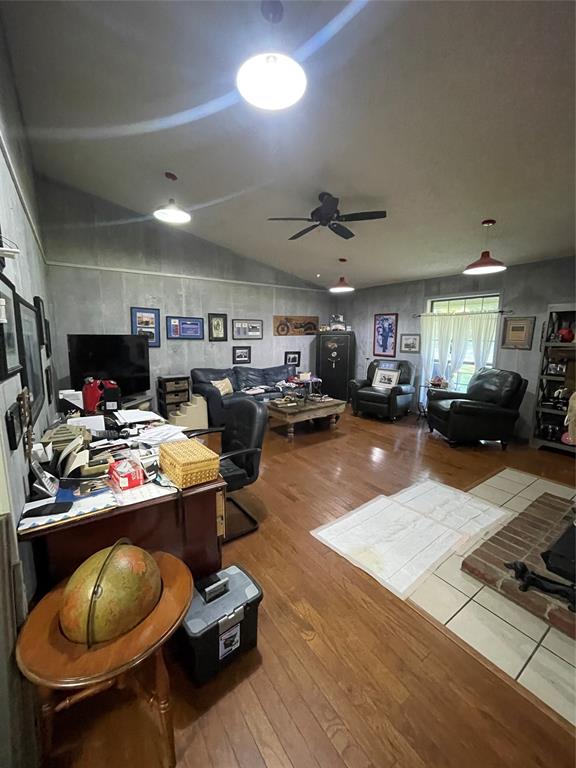 658 Cook Baker Road Sarepta, LA 71071 - Photo 7 of 8 a gym hall with lots of furniture and clutter